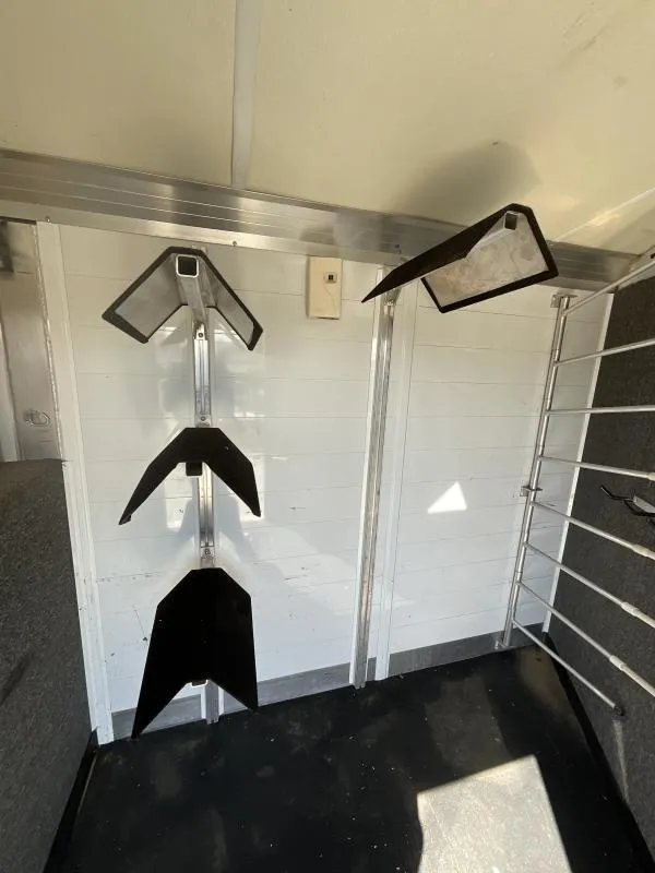 2005 Jamco 4 Horse Gooseneck Trailer – Blue, Air Suspension – Three-tier saddle rack mounted on the tack room wall