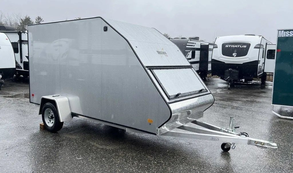 2024 Mission Trailers Crossover Trailer – Galvanized Package – Front three-quarter view from the driver side showing the front access hatch