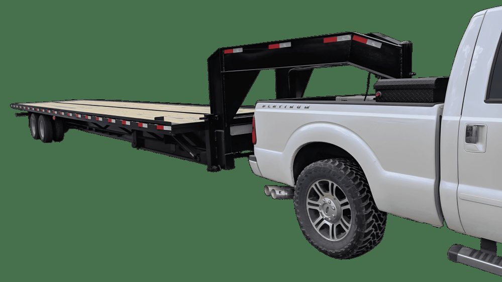 40 ft Tilt Bed Trailer – Twin-Cylinder Hydraulics – Wide angle three-quarter view of a flatbed gooseneck trailer hitched to a truck