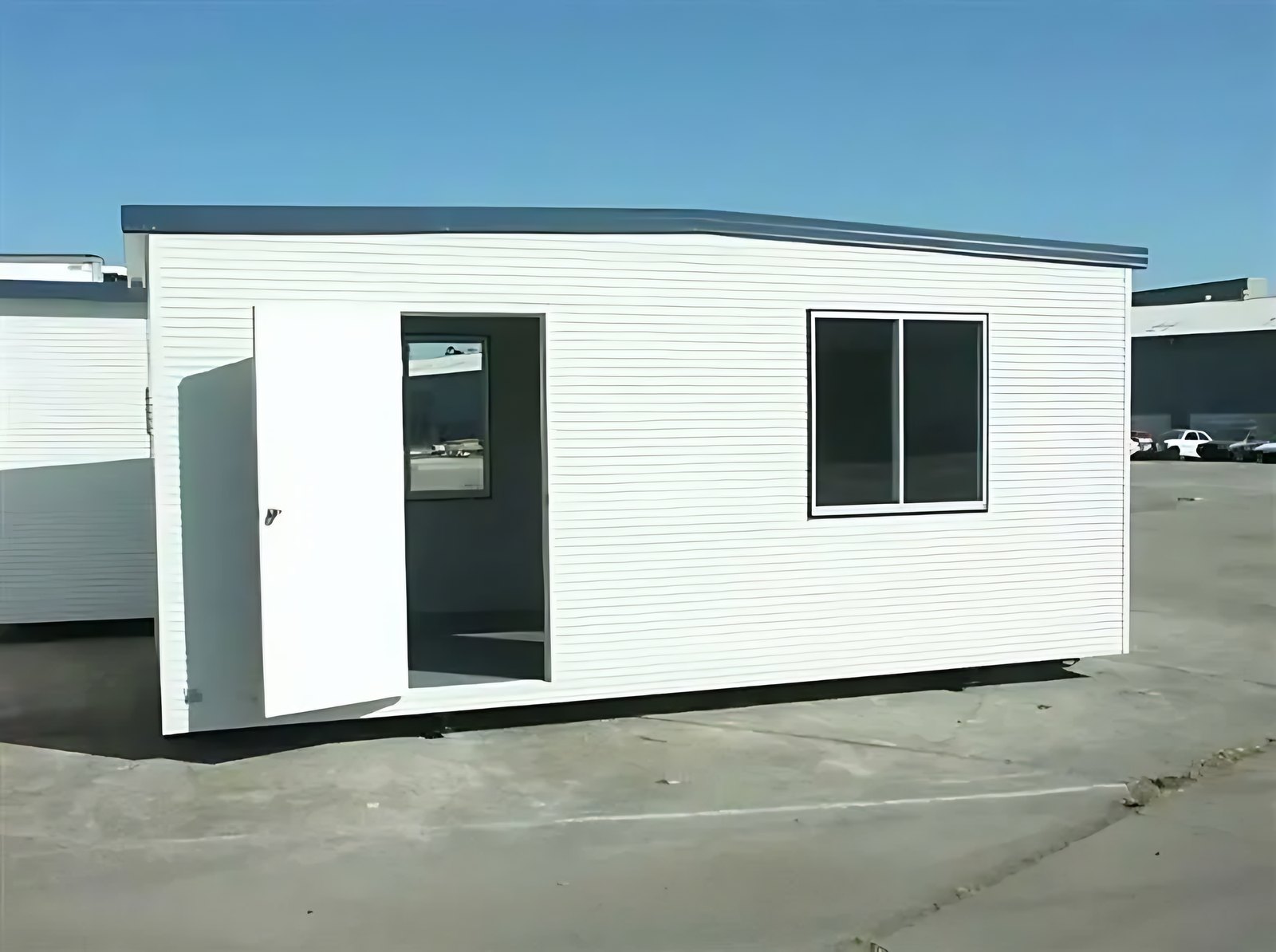 Custom Portable Steel Building – Office, Workshop or Storage – white portable steel building with open door and window