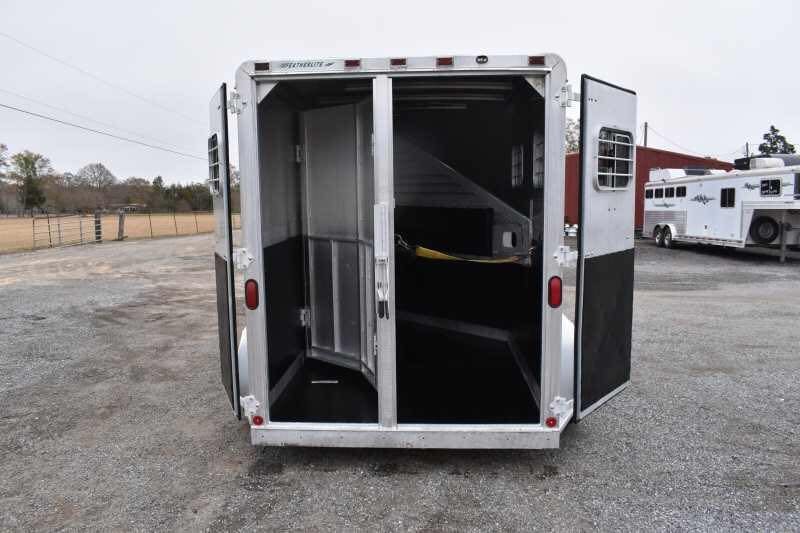 1995 Featherlite 2 Horse Trailer – Aluminum, Dressing Room – Open double rear doors showing the internal metal partition and black floor mats