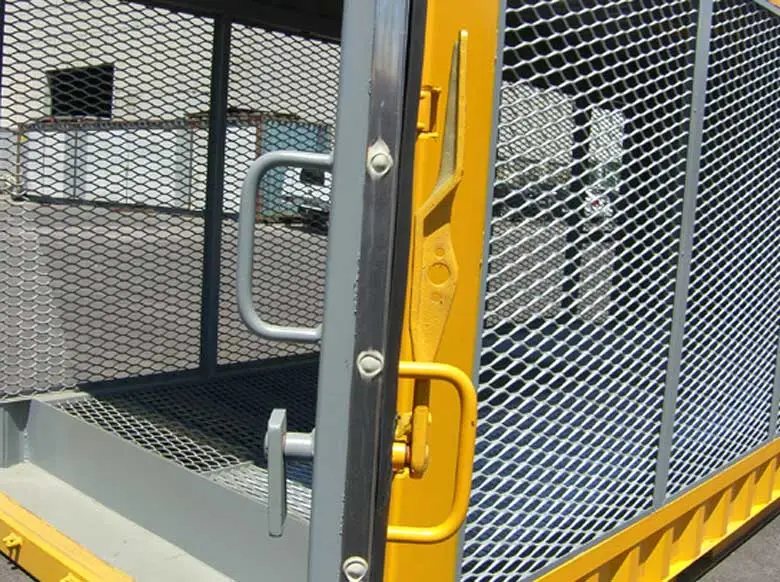 20 ft Gas Cylinder Storage Container – Yellow – Close up of the yellow door latch mechanism and metal mesh panel framing