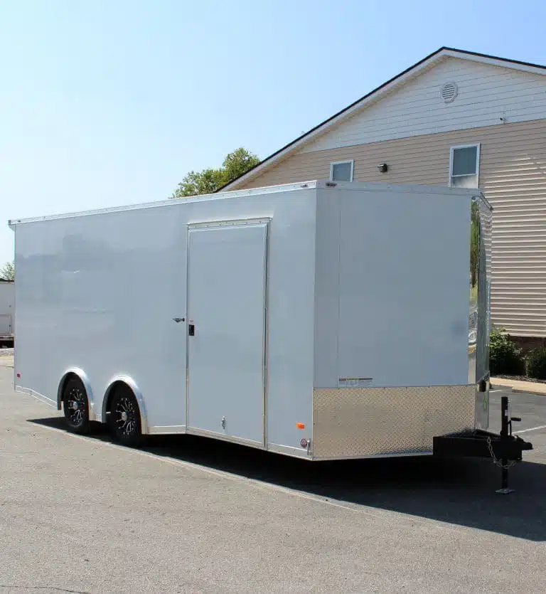 2025 Millennium Blaze 20 ft Enclosed Car Hauler – White – Passenger side of white enclosed trailer showing side entry door and black aluminum wheels