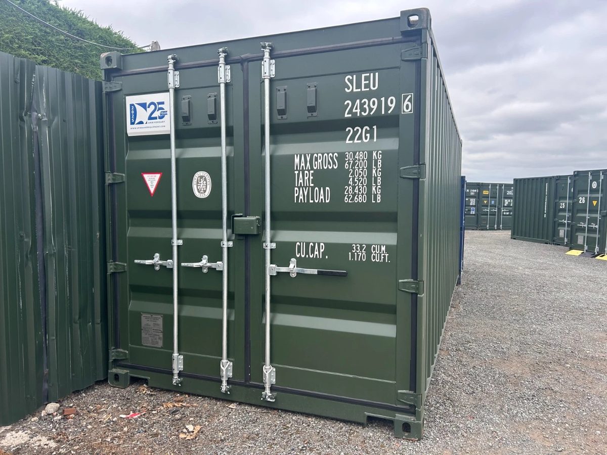 20ft New Shipping Container – One-Trip, Double Doors – Closed green container doors with silver locking bars and white identification markings