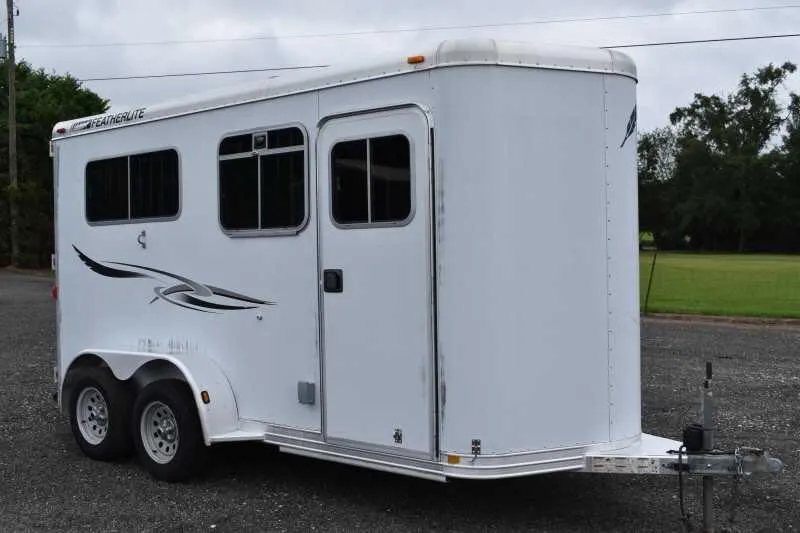 2003 Featherlite 2HST 2 Horse Trailer – Aluminum – Front three-quarter view showing the hitch area and front passenger side