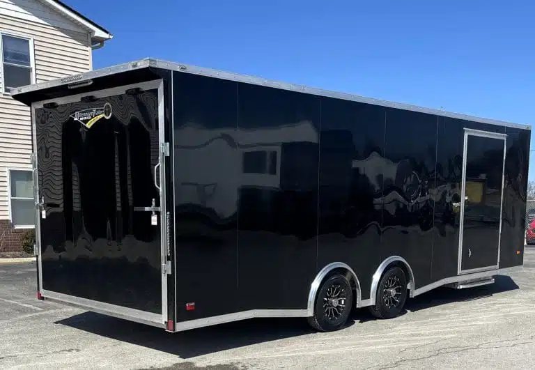2026 Millennium 24 ft Blaze Car Hauler – Black Aluminum – Exterior three-quarter rear view showing the ramp door and side profile