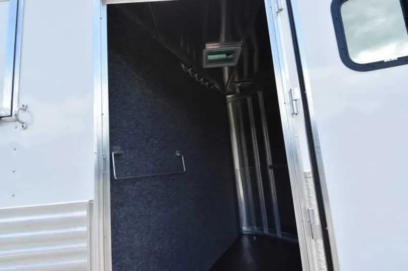 2018 Lakota 4 Horse Trailer – 2 ft Short Wall – Interior view of the front dressing room with carpeted walls