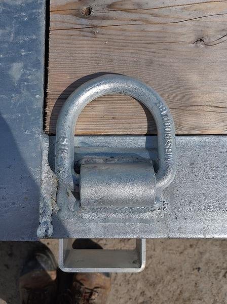 2024 N&N Trailers 20 ft Equipment Trailer – Full-Width Ramps – Top down close up of a heavy duty metal D-ring tie down point
