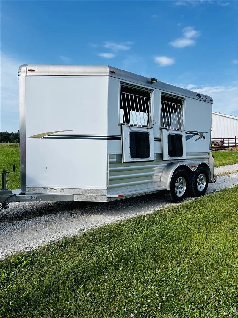 2015 4 Star 2 Horse Bumper Pull – Slant Load, Rear Tack – Three-quarter exterior view of a white horse trailer with drop down windows open