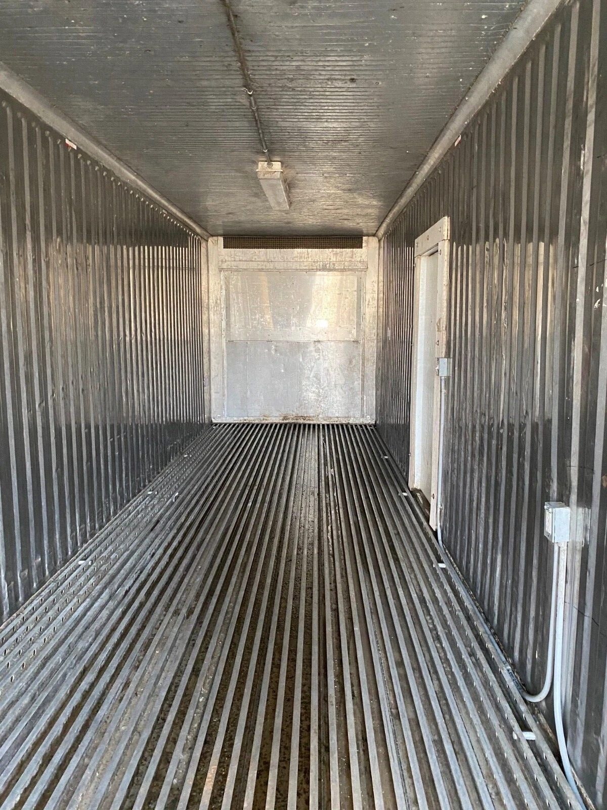 40ft Used Refrigerated Shipping Container – Custom Side Door – empty refrigerated container interior with ribbed floor and side door