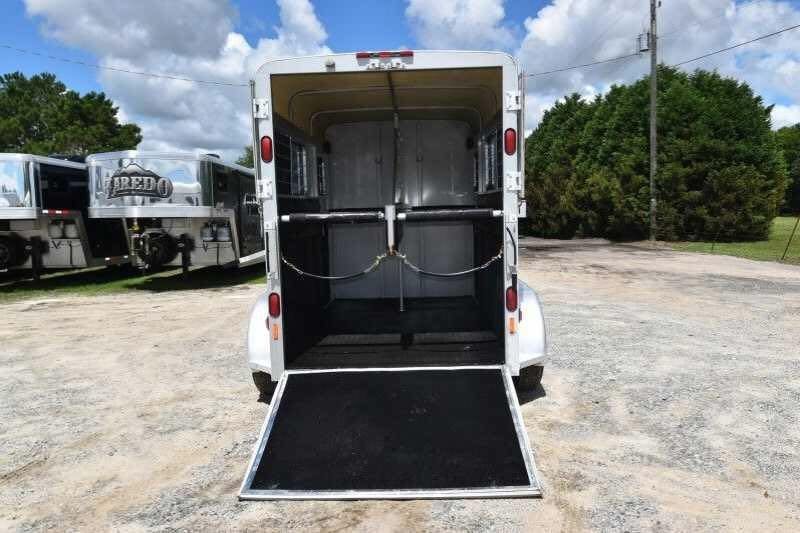 2002 Kiefer Built 2 Horse Bumper Pull – Dressing Room – Rear view of horse trailer with the ramp lowered and rear doors open