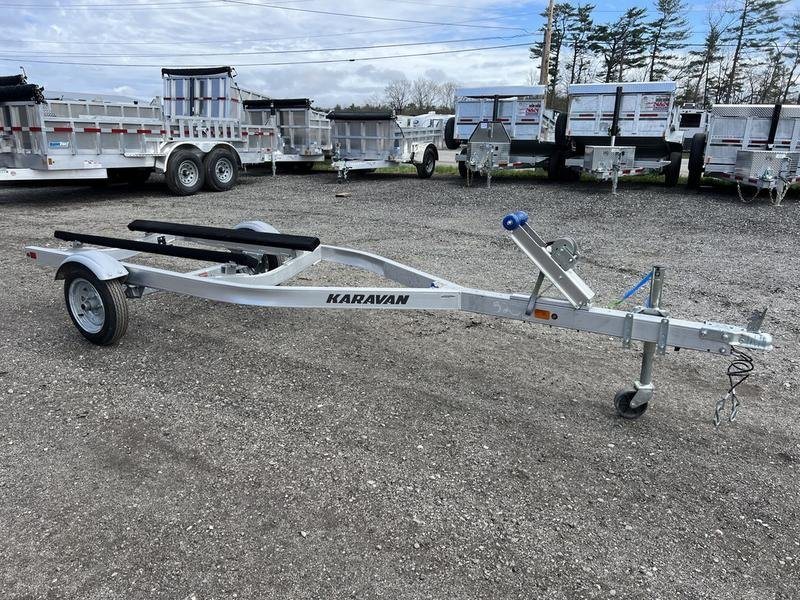 2020 Karavan Single-PWC Trailer – Aluminum, Adjustable Bunks – Profile three-quarter exterior view of a silver aluminum jet ski trailer on gravel