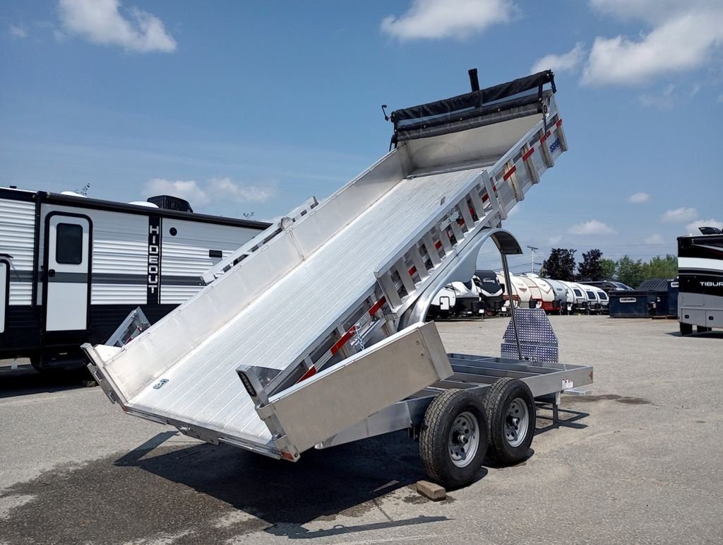 2025 Mission Trailers 16 ft Dump Trailer – Aluminum – Side three-quarter view of the aluminum dump trailer with bed in raised position