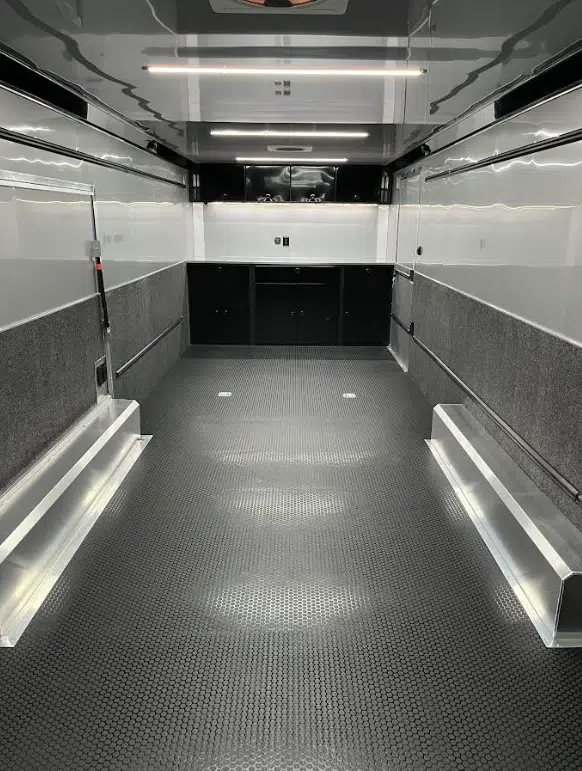 2026 ATC 28 ft Car Trailer – Silverfrost, LifeTrac – Clean interior view showing rubber coin flooring and front black upper and lower cabinets