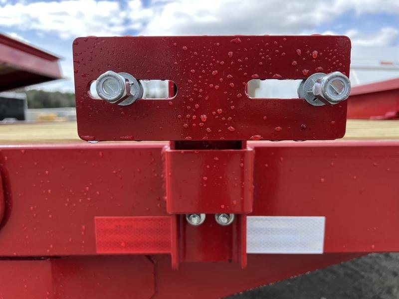 2024 Rice Trailers 22 ft Tilt Deck – Red, Toolbox – Close-up of a red metal bracket and mounting hardware on the trailer