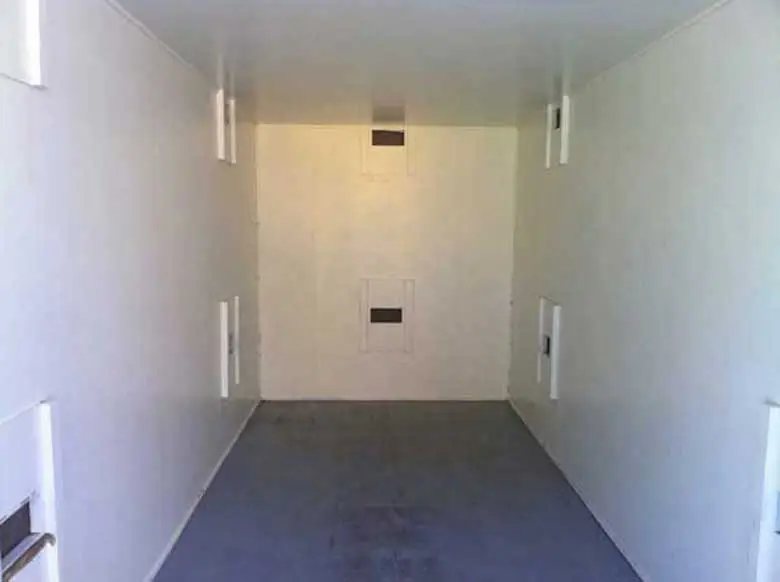 Explosive Storage Magazine – White, Insulated – Empty clean white interior of the insulated storage unit showing wall vents