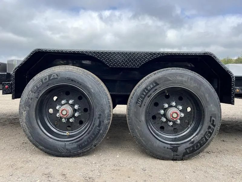 2024 Diamond C 24 ft Tilt Trailer – Spare Mount – Close-up view of the double axles and black wheels under the fender