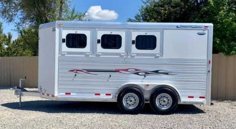 2011 Cimarron 3 Horse Bumper Pull – Insulated Roof – Straight side profile view of the white horse trailer showing graphics
