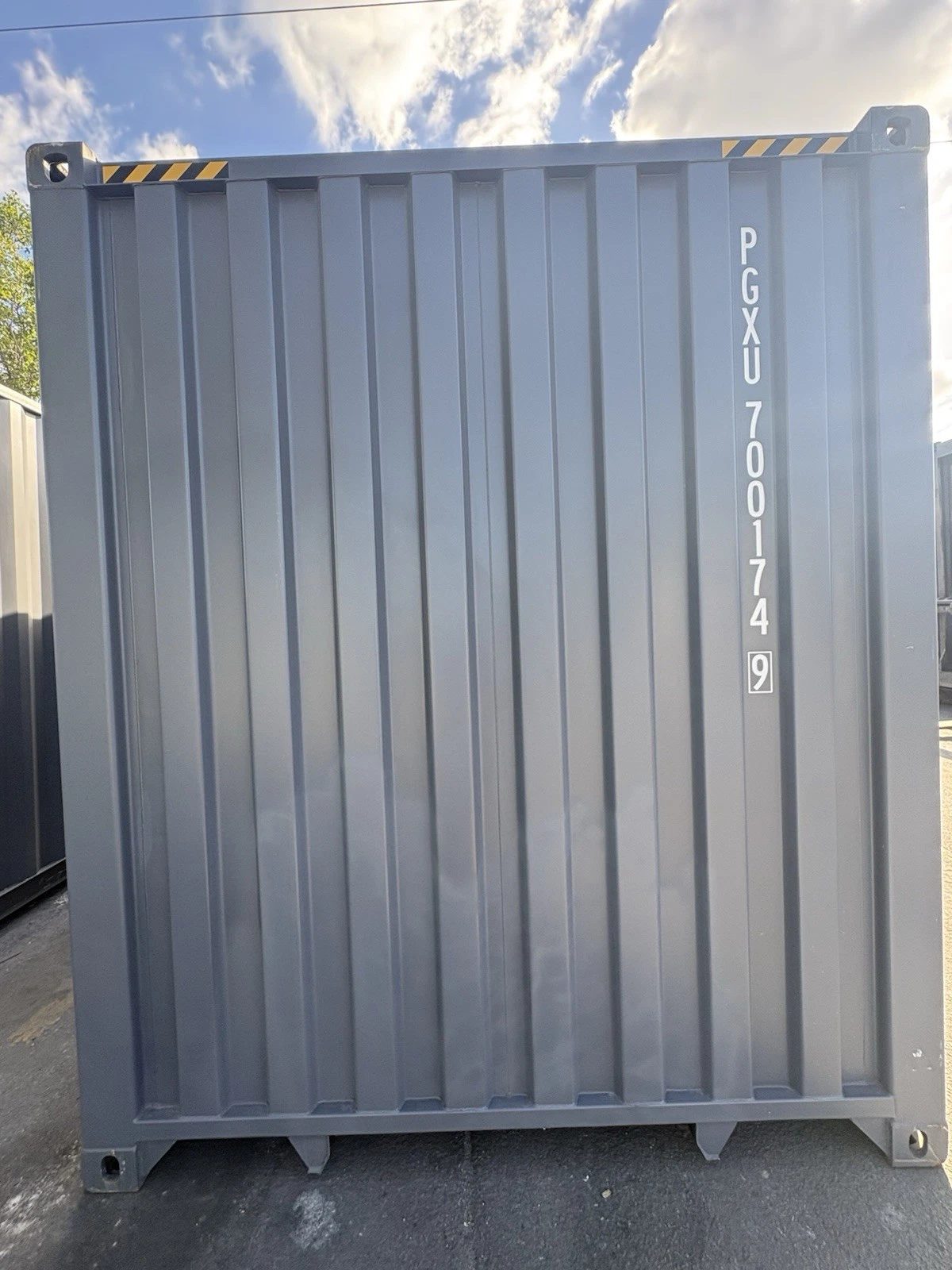 40ft High Cube Shipping Container – New / One-Trip – Straight-on view of gray container closed end wall