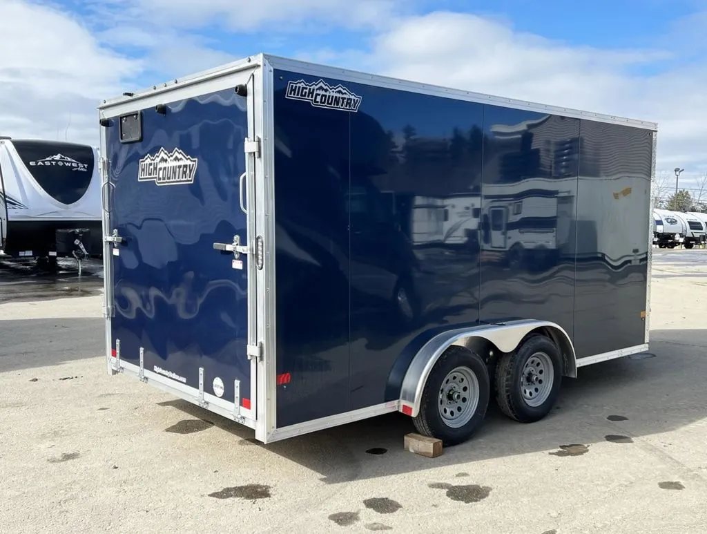 2023 High Country 14 ft Trailer – Blue, Drive-Through – Rear three-quarter angle showing the driver side and the back of the trailer