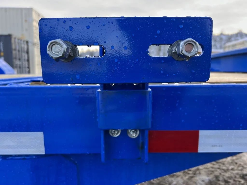 2024 Rice Trailers 20 ft Tilt Trailer – Spare Mount – Close-up of a blue metal mounting bracket with two bolts on the trailer