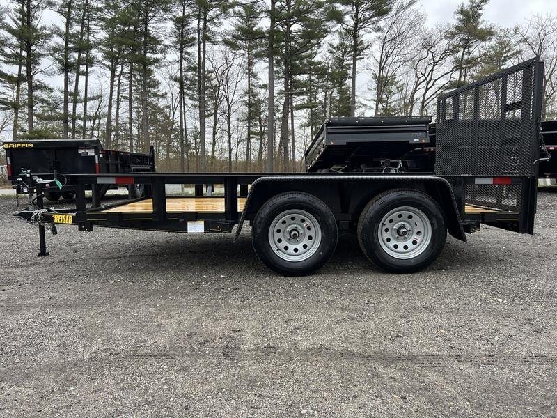 2024 Reiser Trailers 12 ft Landscape Trailer – Ramp Gate – Full side view of the black dual-axle utility trailer showing the wheels and frame