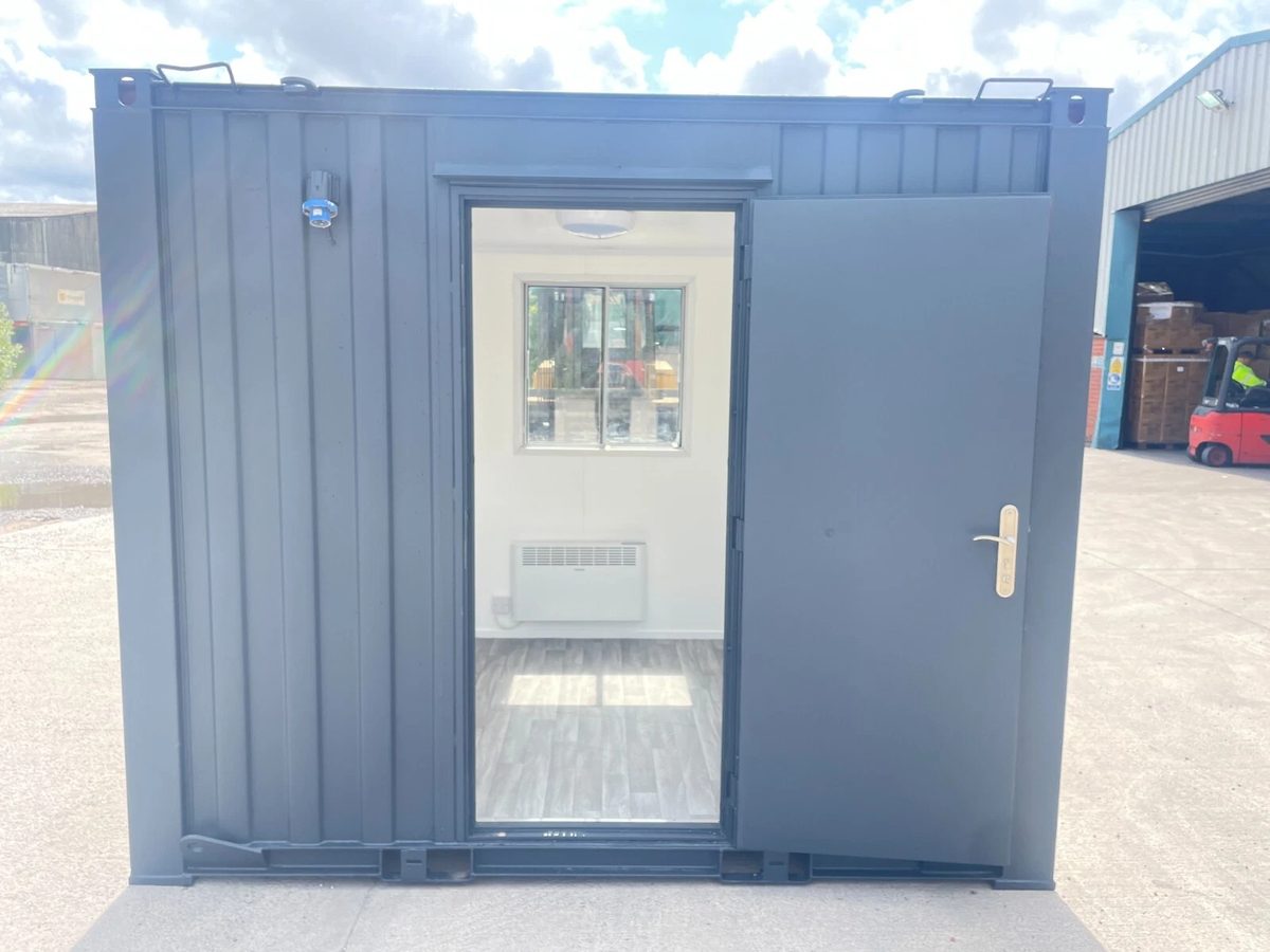 10ft Shipping Container – Unfitted Office Conversion Base – grey office container with open door and empty interior