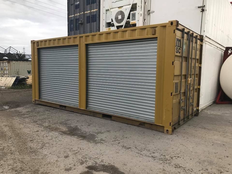 20ft Used Storage Container – Dual Side Roll-Up Doors – Yellow storage container with two closed silver side shutters and end cargo doors