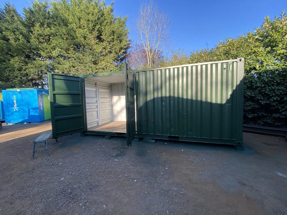 20ft Refurbished Shipping Container – Full-Length Side Access – green storage container with side doors partly open
