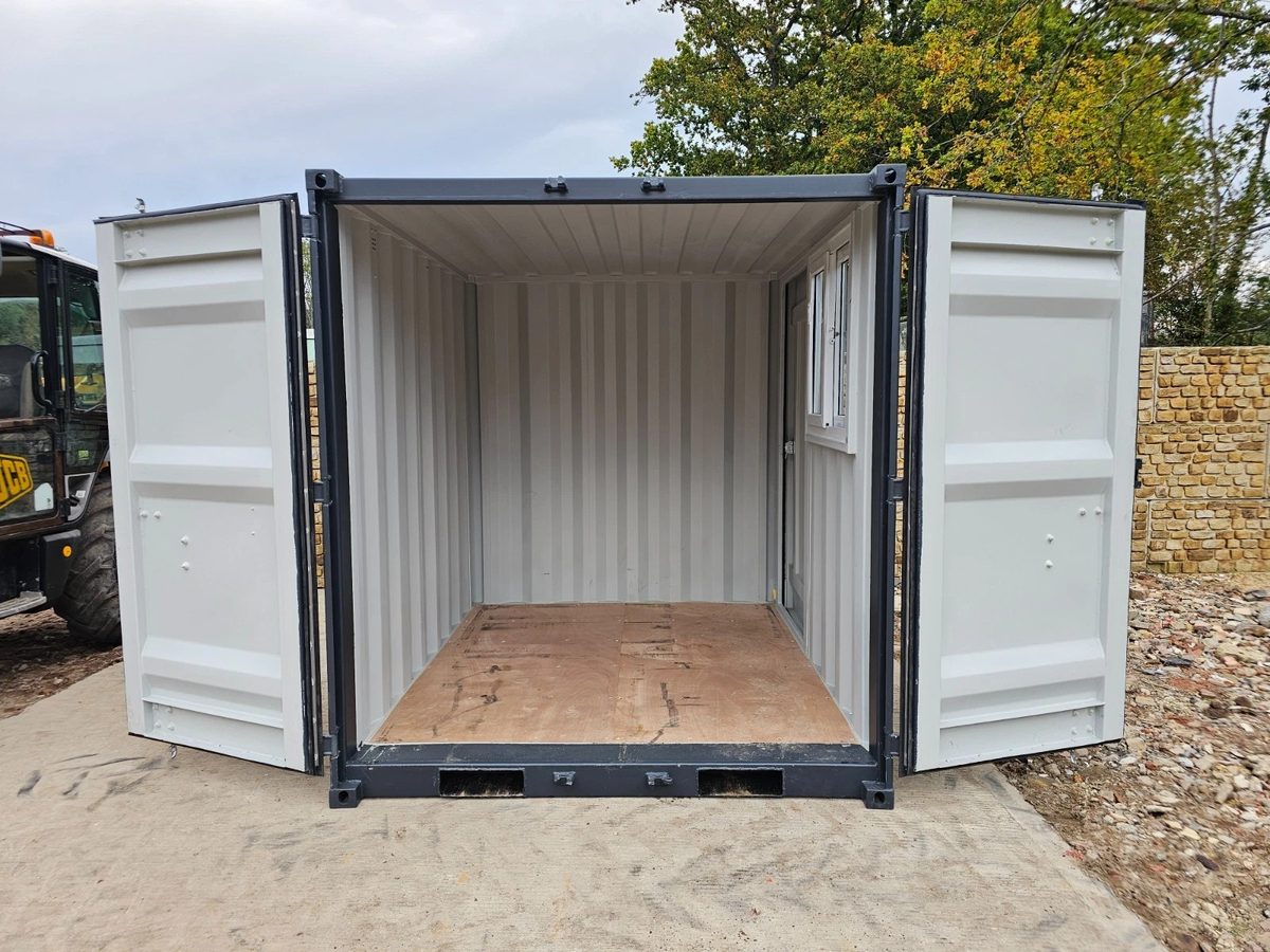8ft New Shipping Container – Lockbox and Barred Windows – open cargo doors revealing empty interior with side window