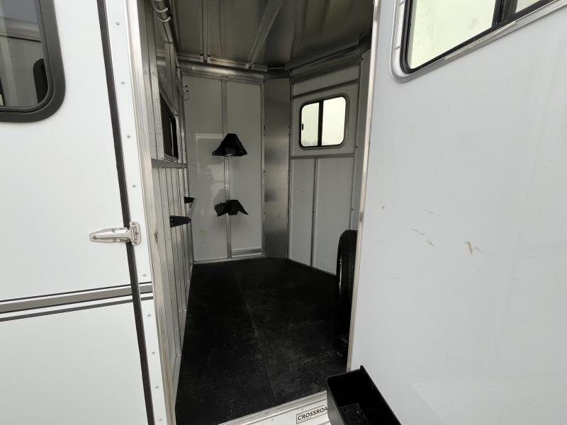 2019 Sundowner Charter 2 Horse Trailer – Warmblood Size – Interior view of the front tack and dressing room through an open door