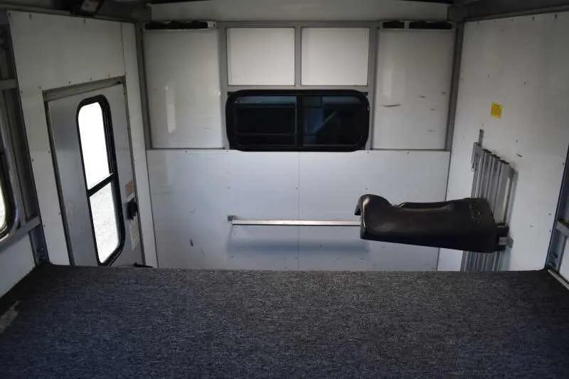 2000 Sundowner 2 Horse Gooseneck Trailer – Dressing Room – View looking down into the carpeted gooseneck sleeping area