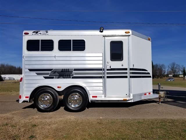 2001 4 Star 2 Horse Bumper Pull Trailer – Slant Load – Full side profile of the horse trailer showing the entry door and wheels