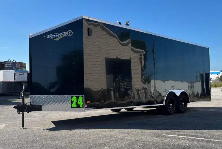 2026 Millennium 24 ft Enclosed Car Hauler – Black Hero – Full three-quarter front view of a black enclosed car hauler trailer outdoors