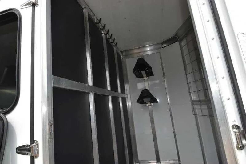 2016 Shadow 2 Horse Trailer – Aluminum, Dressing Room – Inside the dressing or tack room showing wall-mounted hooks and saddle racks