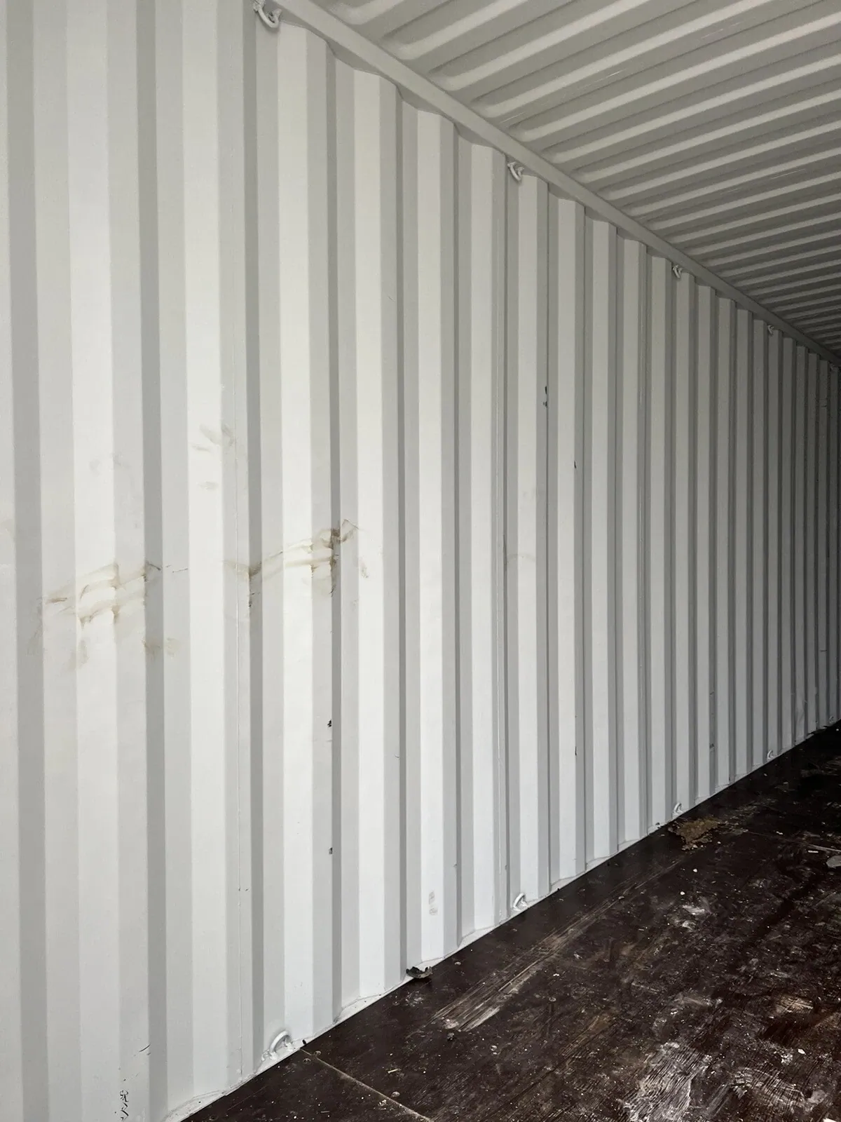 40ft High Cube Shipping Container – One-Trip, Double Doors – Empty container interior with corrugated walls and scuffed wooden floor