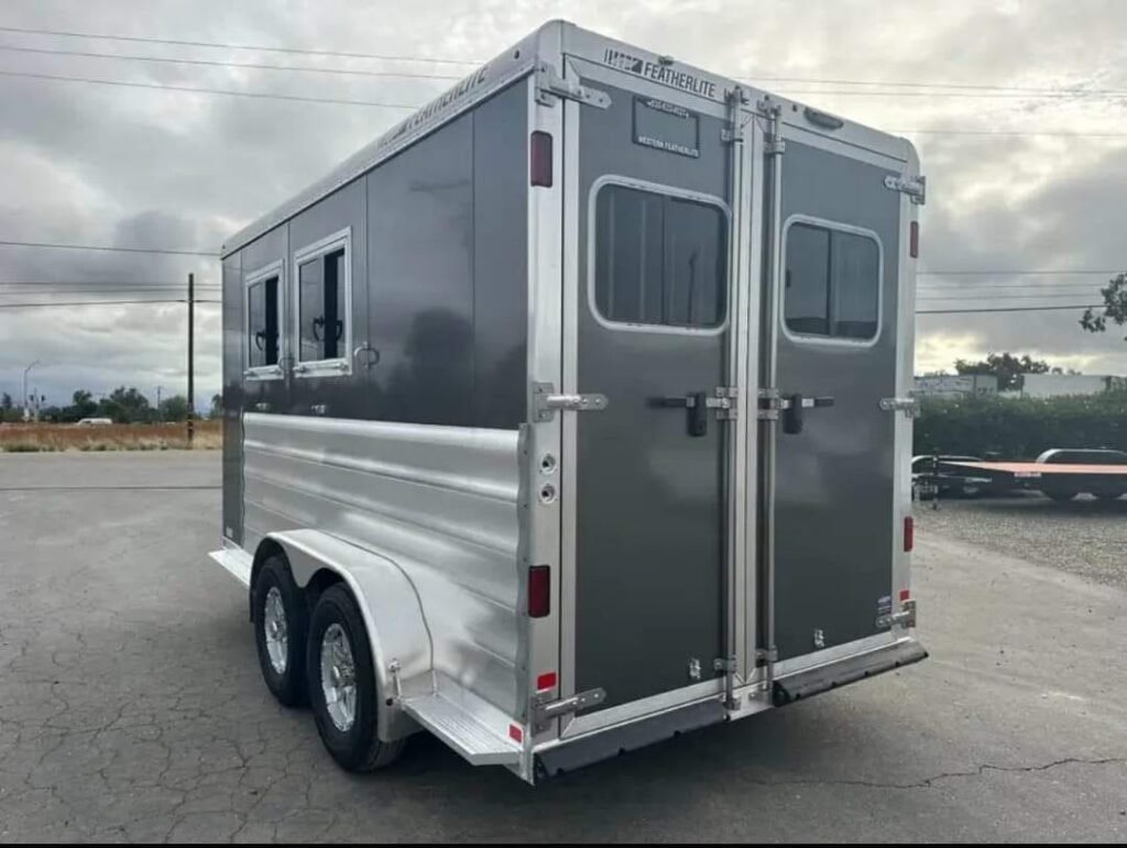 2012 Featherlite 9400 2 Horse Trailer – Removable Tack – Rear view of the horse trailer showing the left side and closed doors