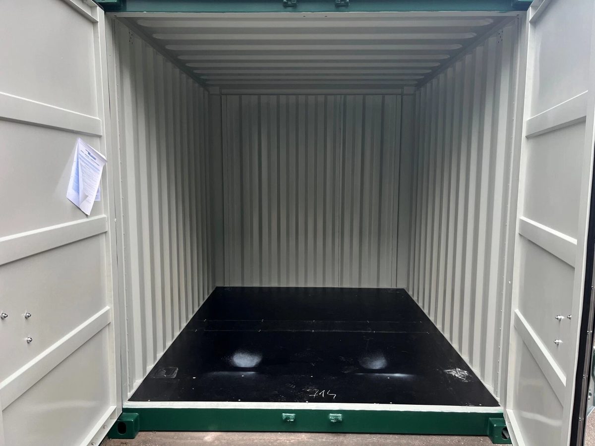 10ft New Shipping Container – Double Cargo Doors – empty container interior with open doors and dark floor