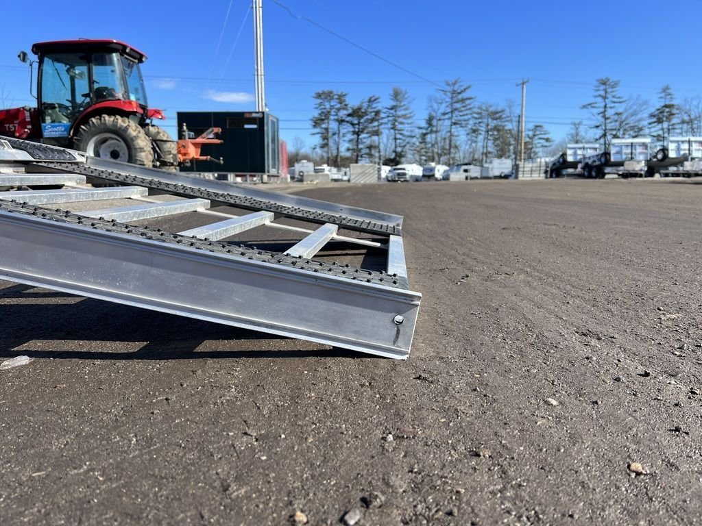 2023 Sno Pro 8 ft Sled Deck – Sliding Sides – Low angle detail of the ramp foot on the ground