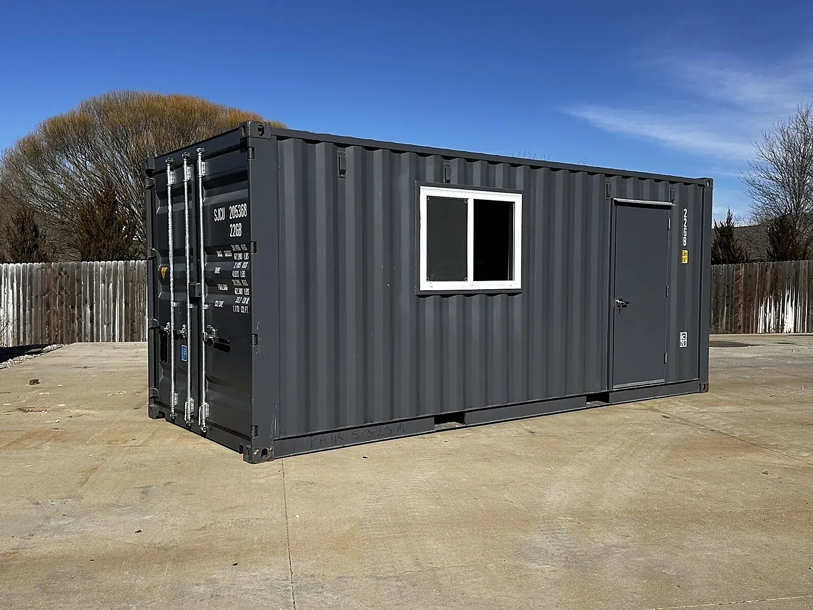 20ft Slate Gray Office Container – White Shiplap Interior – Three-quarter exterior with cargo doors, window and side entry door
