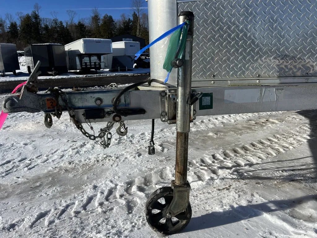 2008 Sno Pro 4-Place Snowmobile Trailer – Black Aluminum – Close-up of the trailer hitch and tongue jack assembly