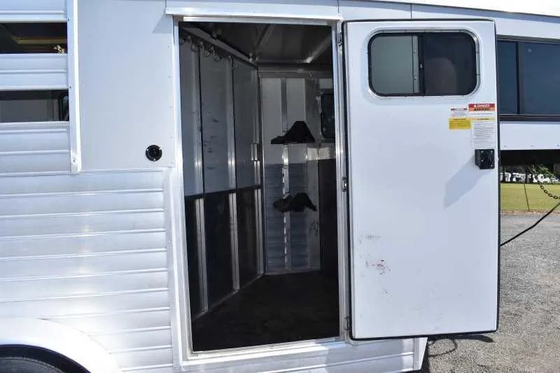 2014 Sundowner 2 Horse Gooseneck Trailer – Electric Jack – Close up of an open side entry door leading into the trailer