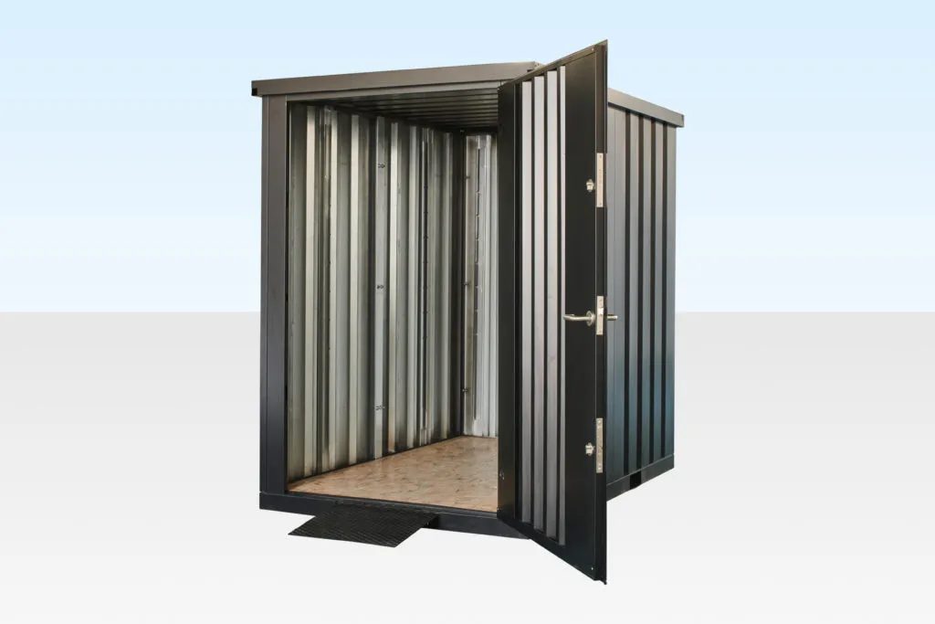 Flat Pack Steel Garden Store – Shelving And Retractable Ramp – three-quarter view of steel storage shed with door open