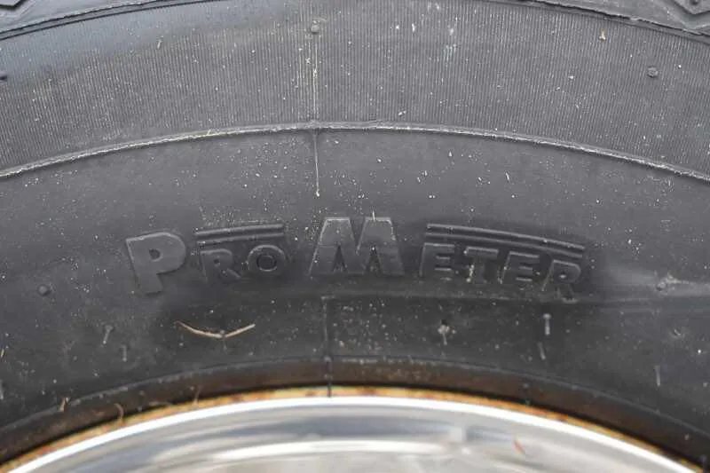 1995 Featherlite 2 Horse Trailer – Aluminum, Dressing Room – Extreme close-up of the tire sidewall showing brand and tread details
