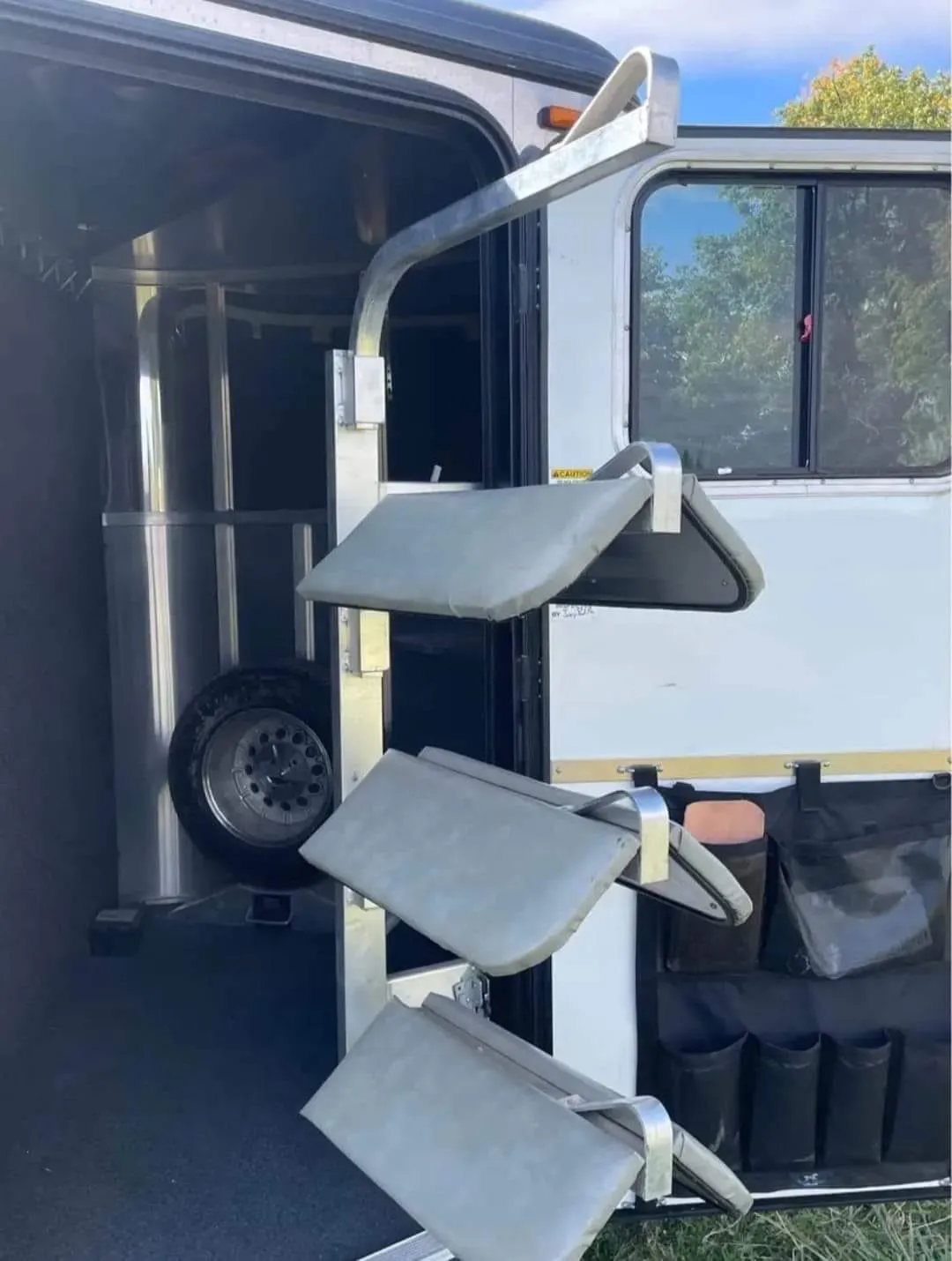 2005 Classic 16 ft 3 Horse Trailer – Dual Tack – A swing-out saddle rack mounted on the dressing room door frame