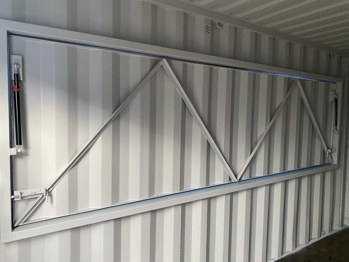 15ft Custom Container Bar & Kiosk – Side Service Hatches – interior view of closed service hatch with reinforcing braces
