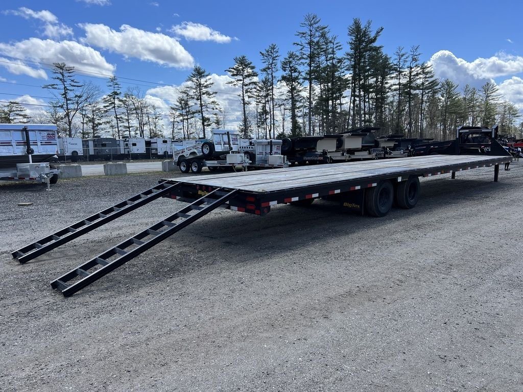 2023 Big Tex 40 ft Equipment Trailer – Slide-Out Ramps – Low angle rear three-quarter view showing dual slide-out ramps extended to the ground