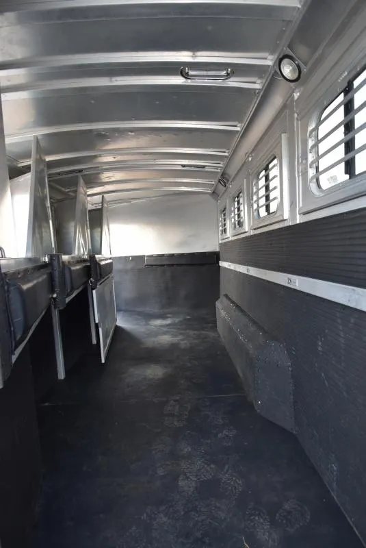 2008 C and C Trailers 4 Horse Bumper Pull – Hay Pod – Wide view of the empty horse stall area with rubber floor mats