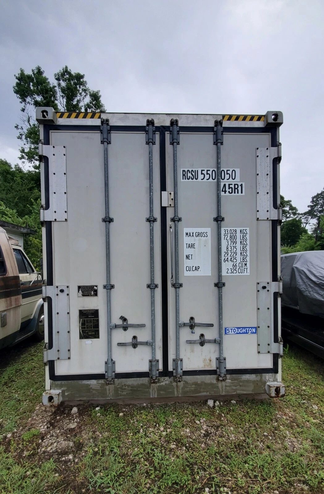 40ft As-Is Insulated Container – Electrical Connection – Closed insulated container doors with locking bars, identification markings, and data plates