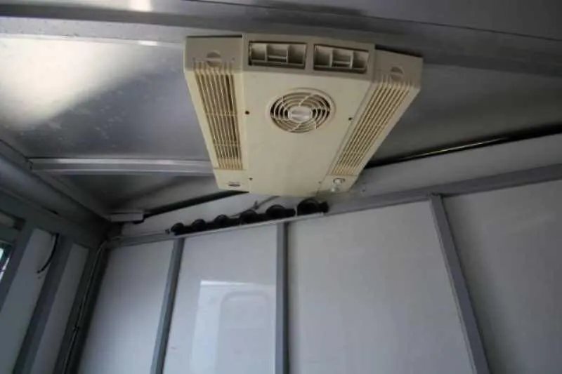 2003 Sundowner 2 Horse Trailer – Dressing Room – Close-up of a ceiling mounted air conditioning unit inside the trailer